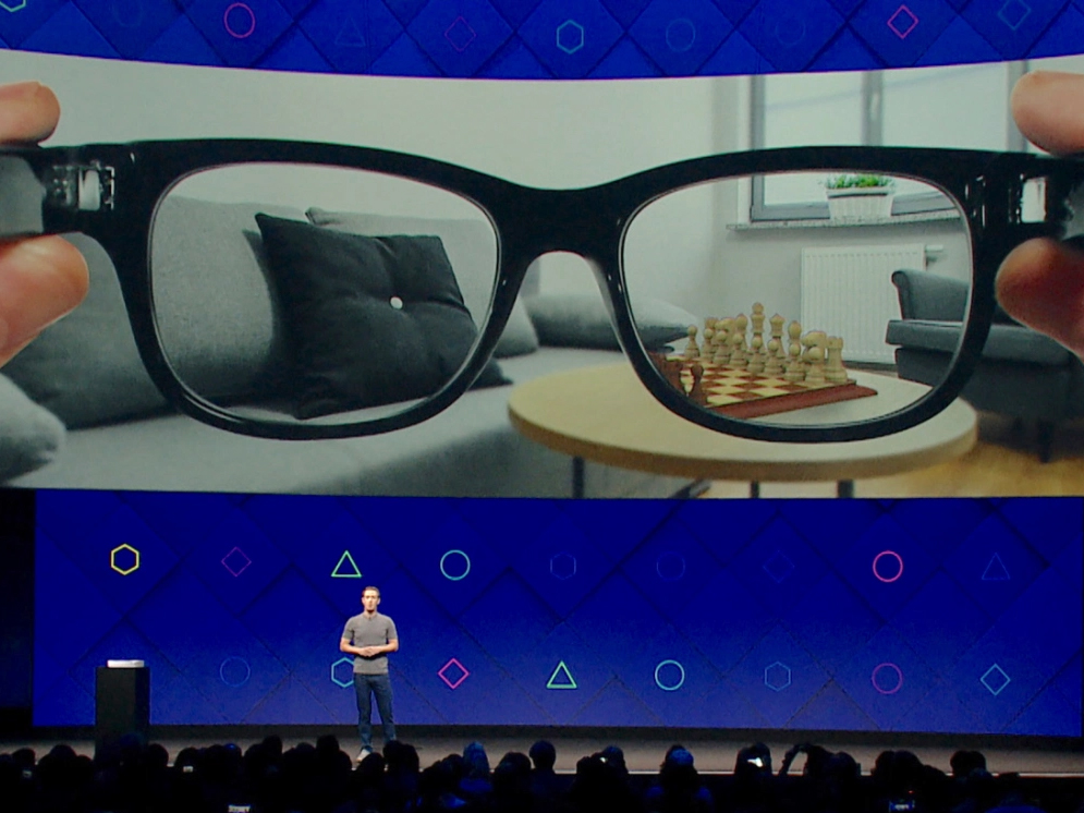A photo of a presentation, showing concept art for all-day-wearable AR glasses.